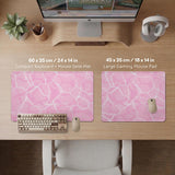 Soft pink desk mat with a kawaii cloud-marble pattern, white crackle lines, and small star accents.