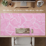 Soft pink desk mat with a kawaii cloud-marble pattern, white crackle lines, and small star accents.