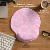 Pastel pink desk mat with a marble-style design, white flowing lines, and small sparkle accents.