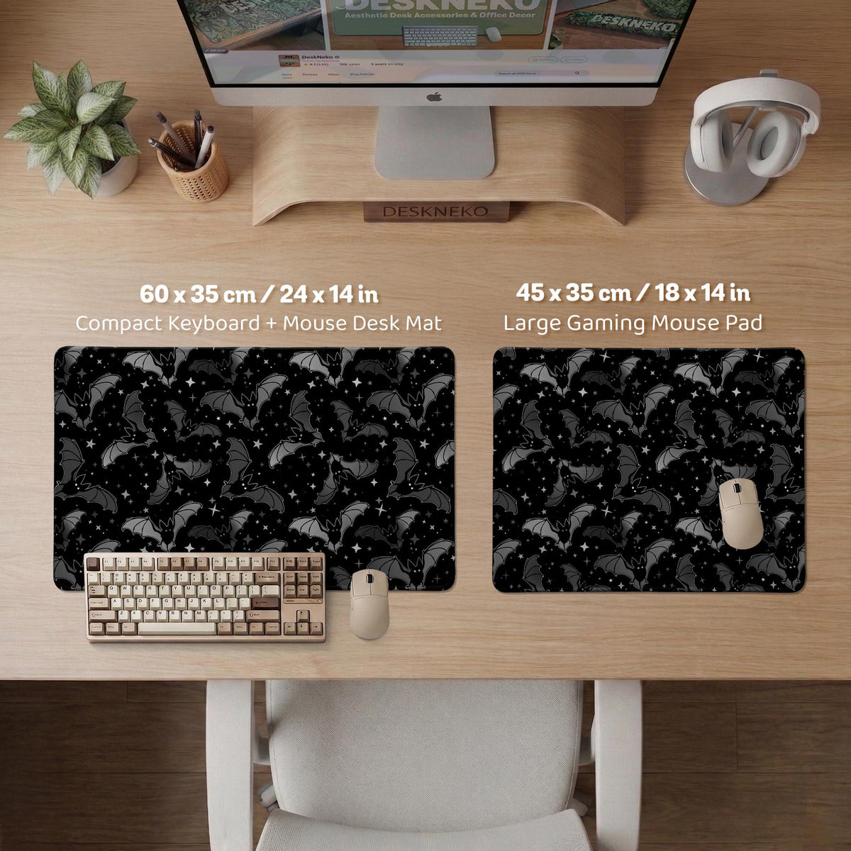 Black desk mat with a dark bat pattern and scattered stars on a charcoal background.