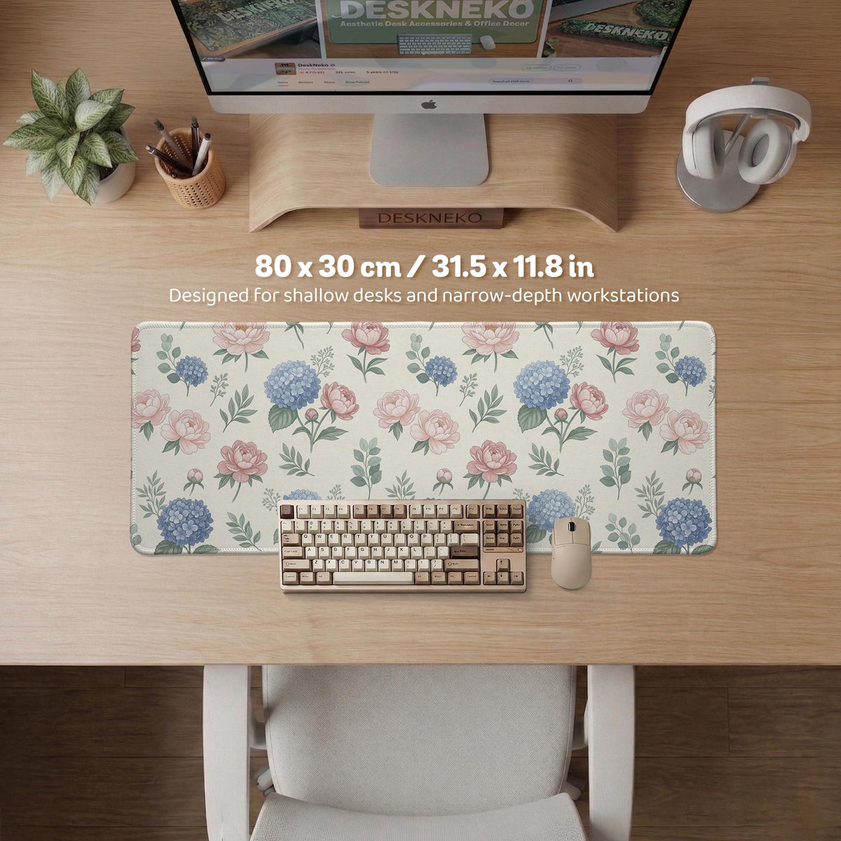 Floral desk mat with sage greenery, pink peonies, blue flowers, and a warm cream background.