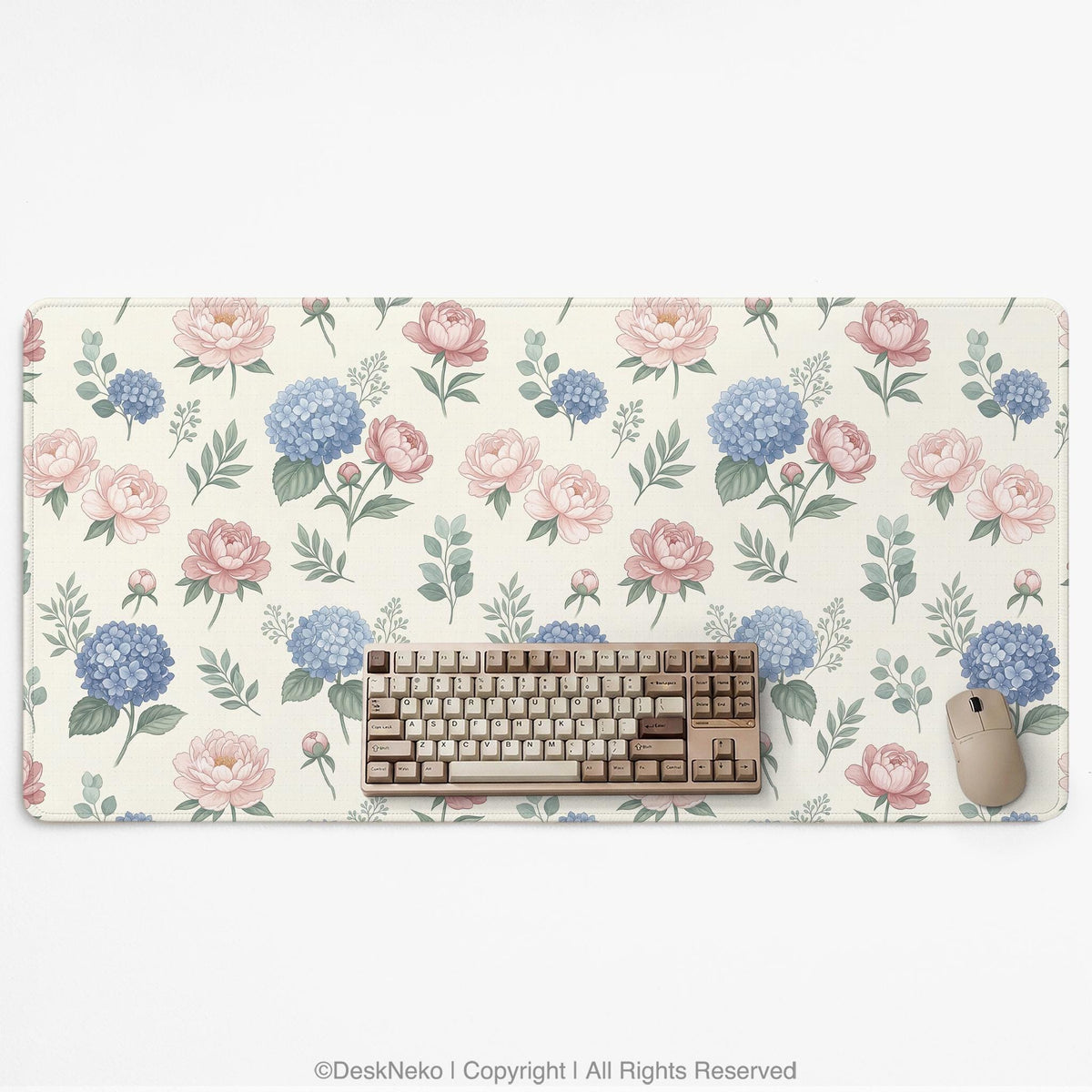 Floral desk mat with sage greenery, pink peonies, blue flowers, and a warm cream background.