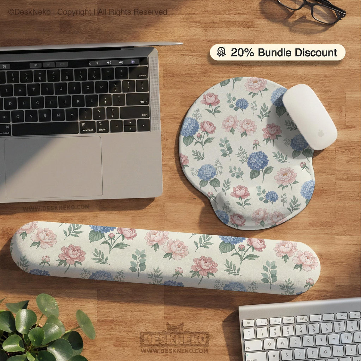 Floral desk mat with sage greenery, pink peonies, blue flowers, and a warm cream background.