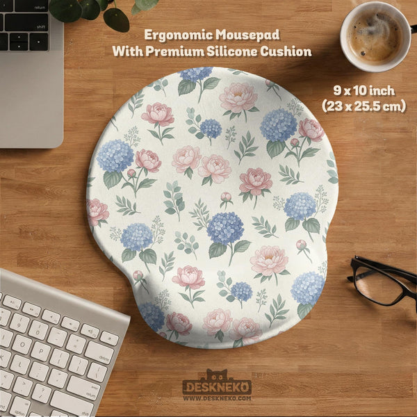 Floral desk mat with sage greenery, pink peonies, blue flowers, and a warm cream background.