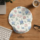 Mousepad and keyboard wrist rest with a floral print of blue hydrangeas, pink peonies, sage leaves, and a cream background.