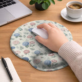 Mousepad and keyboard wrist rest with a floral print of blue hydrangeas, pink peonies, sage leaves, and a cream background.