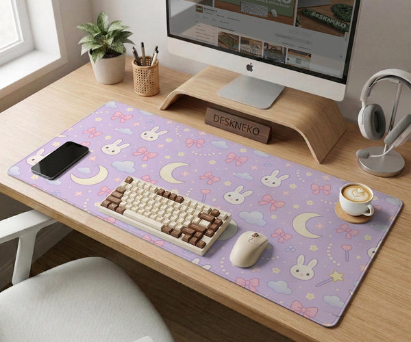 Pastel lavender desk mat with an all-over pattern of bunnies, crescent moons, clouds, bows, stars, and small flowers.