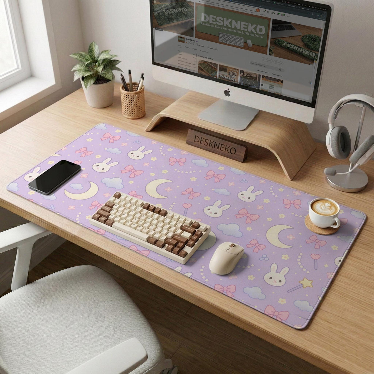 Pastel lavender desk mat with an all-over pattern of bunnies, crescent moons, clouds, bows, stars, and small flowers.