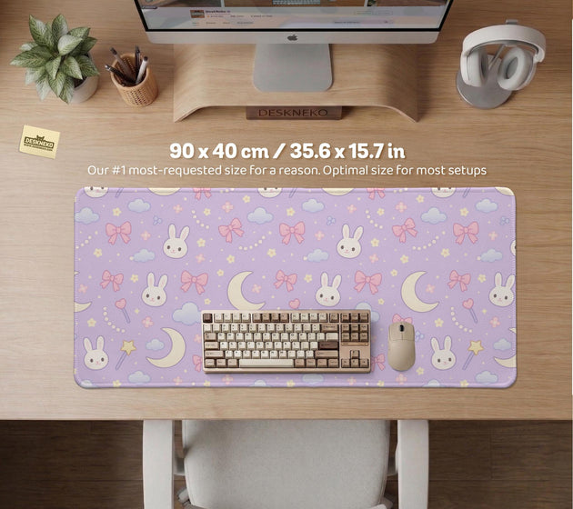 Pastel lavender desk mat with an all-over pattern of bunnies, crescent moons, clouds, bows, stars, and small flowers.