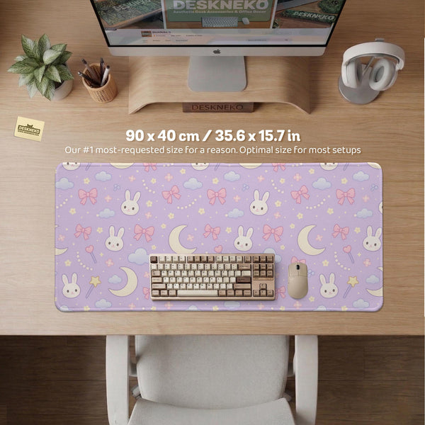 Pastel lavender desk mat with an all-over pattern of bunnies, crescent moons, clouds, bows, stars, and small flowers.