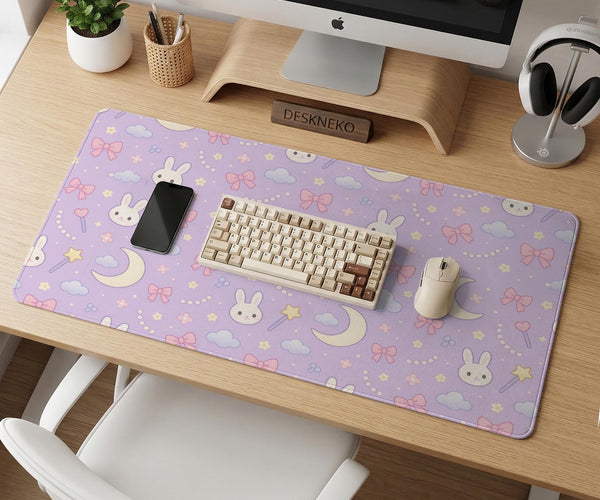 Pastel lavender desk mat with an all-over pattern of bunnies, crescent moons, clouds, bows, stars, and small flowers.