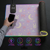 Pastel lavender desk mat with an all-over pattern of bunnies, crescent moons, clouds, bows, stars, and small flowers.