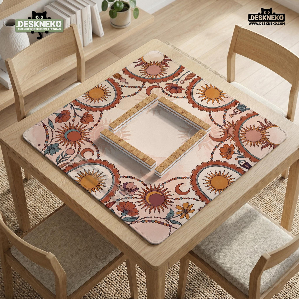 A square mahjong mat with a scalloped edge, sun and moon artwork, terracotta flowers, a soft cream background, and a decorative border around the play area.