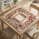 A square mahjong mat with a scalloped edge, sun and moon artwork, terracotta flowers, a soft cream background, and a decorative border around the play area.