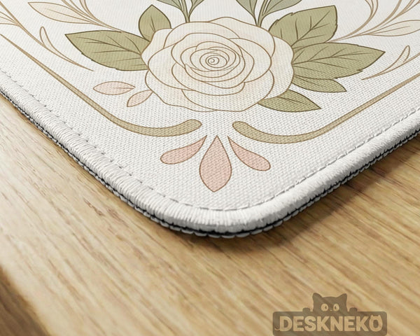 Square mahjong mat with a light floral border in sage green, cream, and blush around a plain center play area.