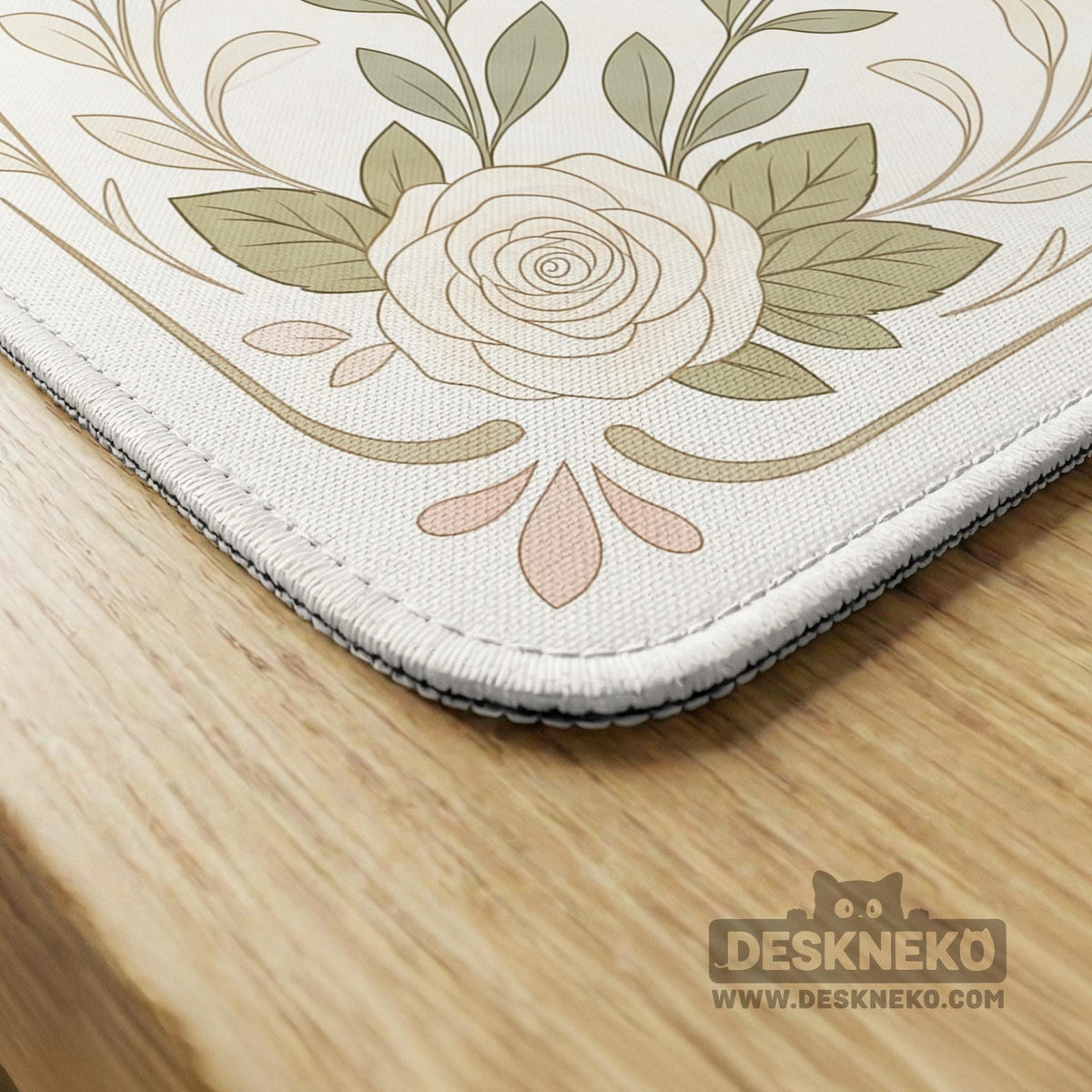 Square mahjong mat with a light floral border in sage green, cream, and blush around a plain center play area.