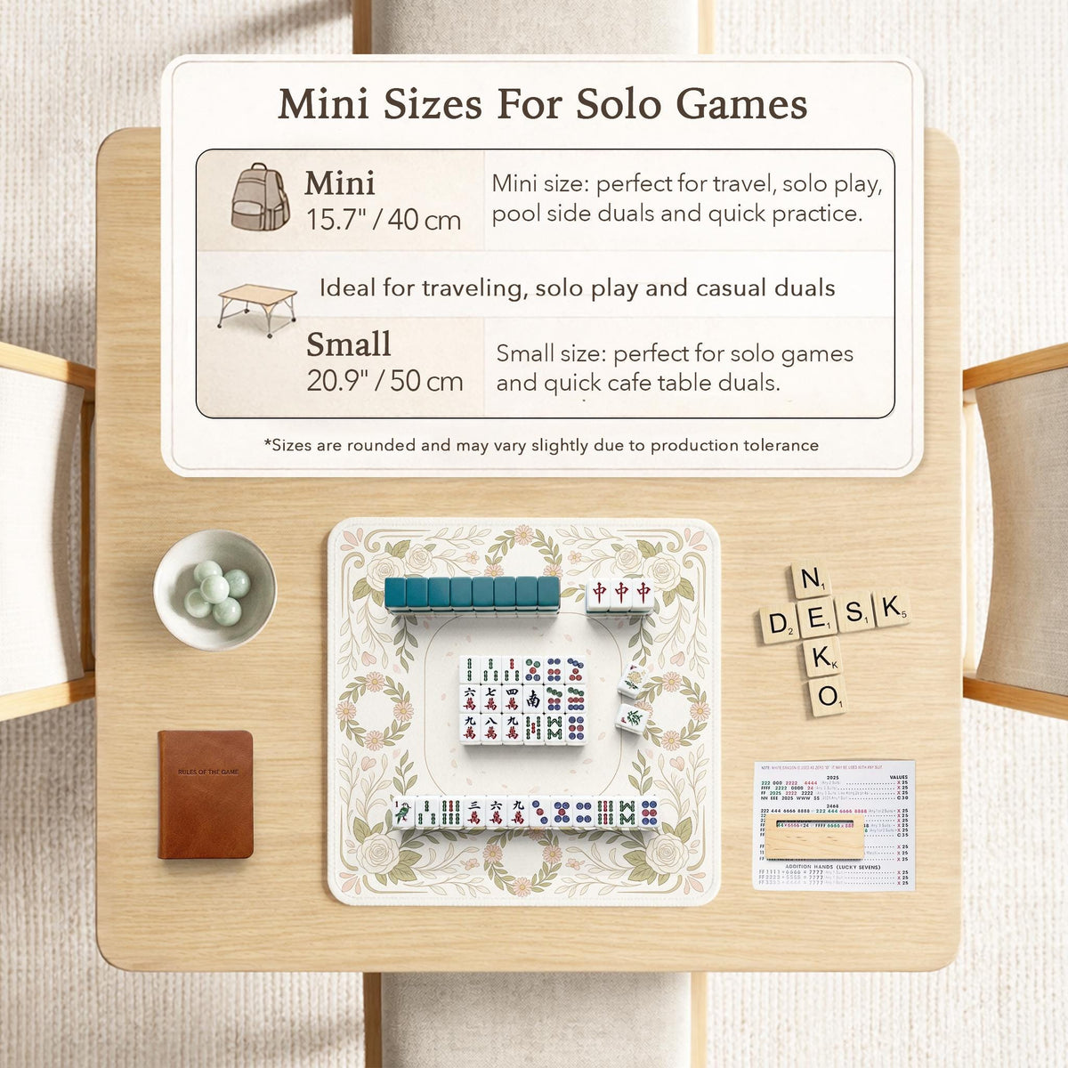 Square mahjong mat with a light floral border in sage green, cream, and blush around a plain center play area.