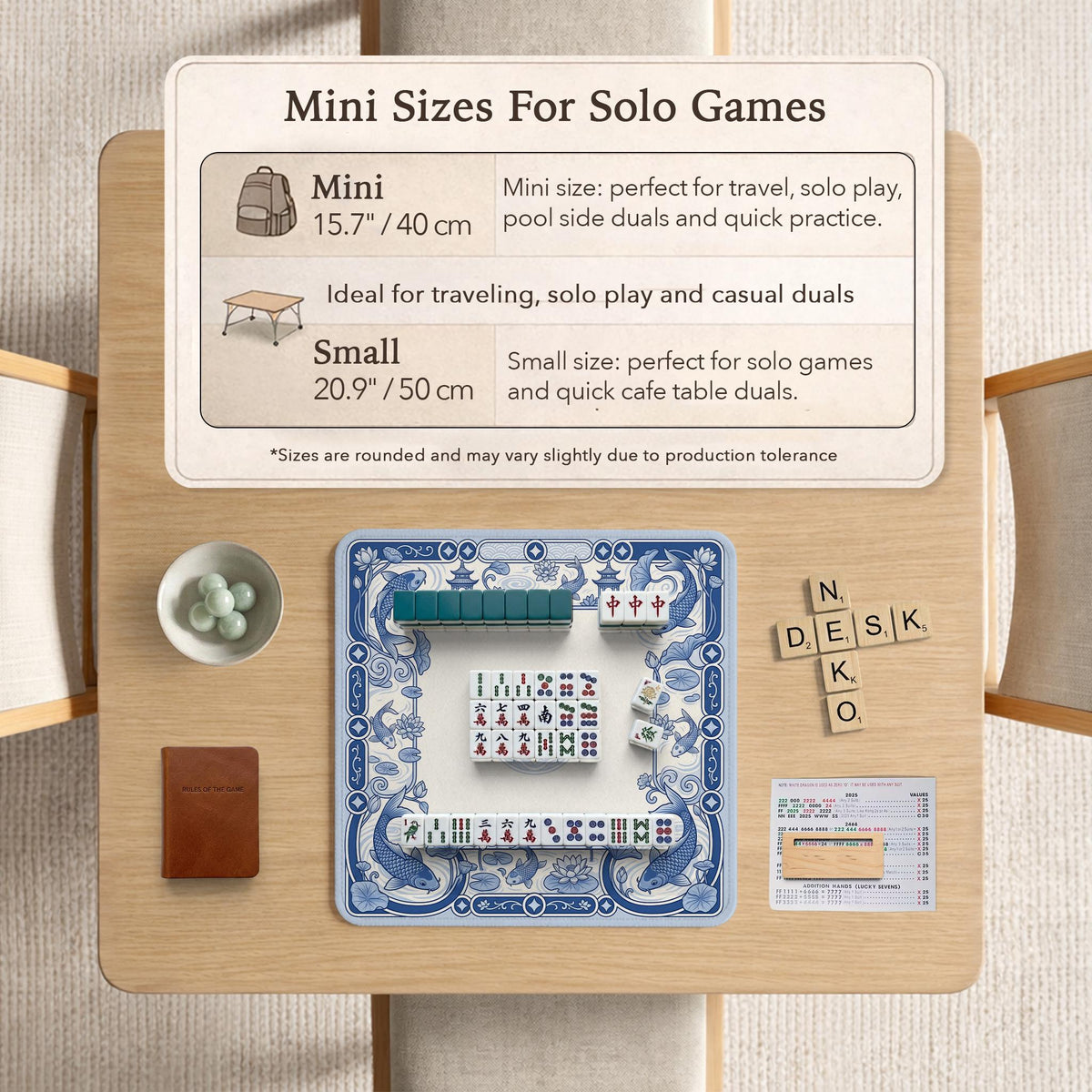 Navy blue square mahjong table mat with lotus flowers and koi fish in a porcelain-style border and a plain center.