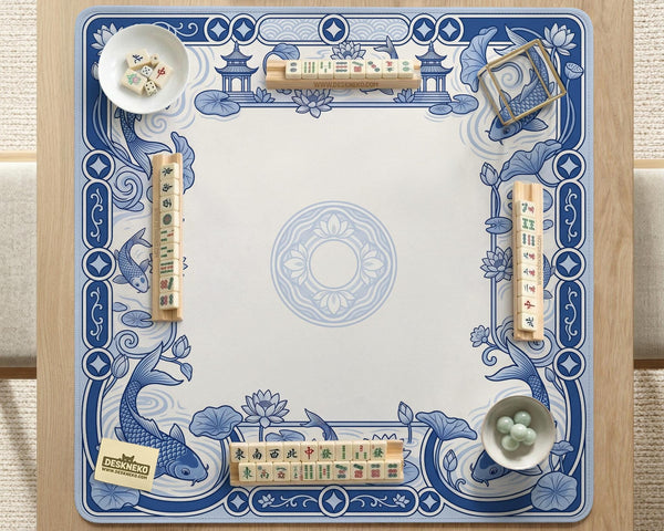 Blue and white square mahjong mat with a koi fish and lotus border design and a plain center area.