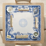 Blue and white square mahjong mat with a koi fish and lotus border design and a plain center area.
