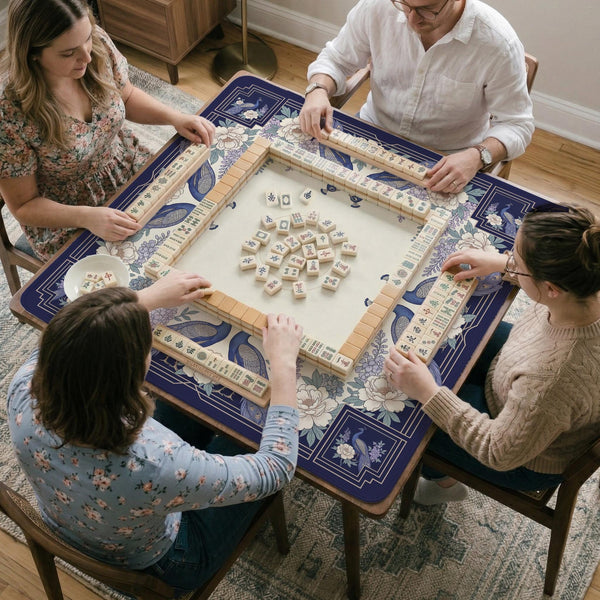 Blue mahjong table mat with a peacock and floral border, ivory center, lavender flowers, and scalloped edges.