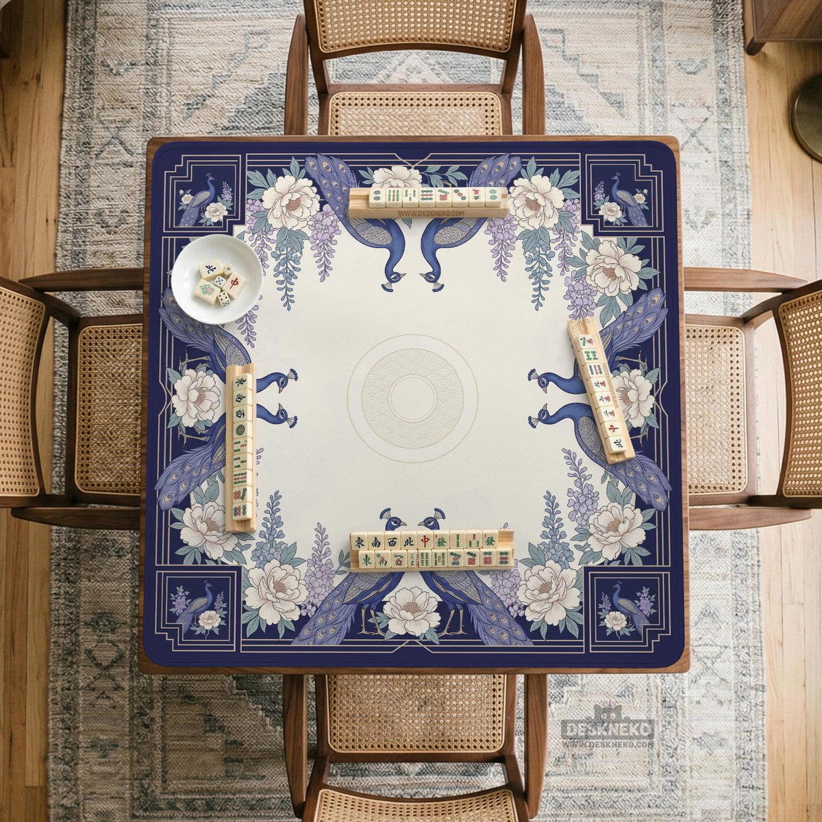 Blue mahjong mat with a floral peacock border and an open center area for tile play.