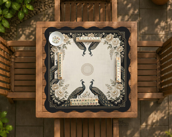 Square ivory mahjong mat with a black peacock border, cream flowers, and gold accent details.