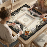 Square ivory mahjong mat with a black peacock border, cream flowers, and gold accent details.