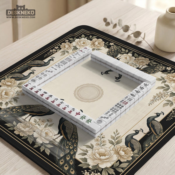 Square ivory mahjong mat with a black peacock border, cream flowers, and gold accent details.