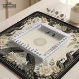 Square ivory mahjong mat with a black peacock border, cream flowers, and gold accent details.