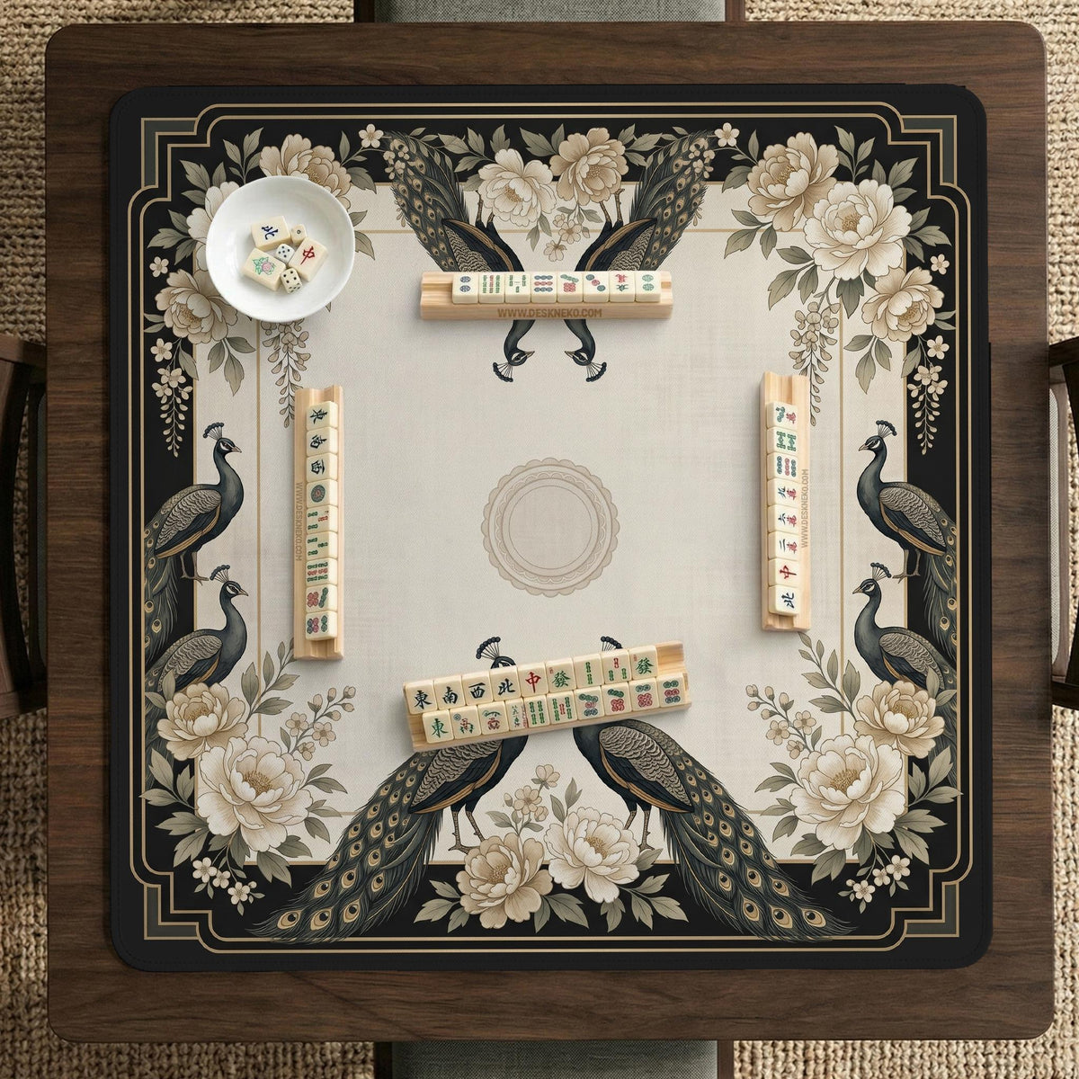 Square ivory mahjong mat with a black peacock border, cream flowers, and gold accent details.