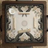 Square ivory mahjong mat with a black peacock border, cream flowers, and gold accent details.