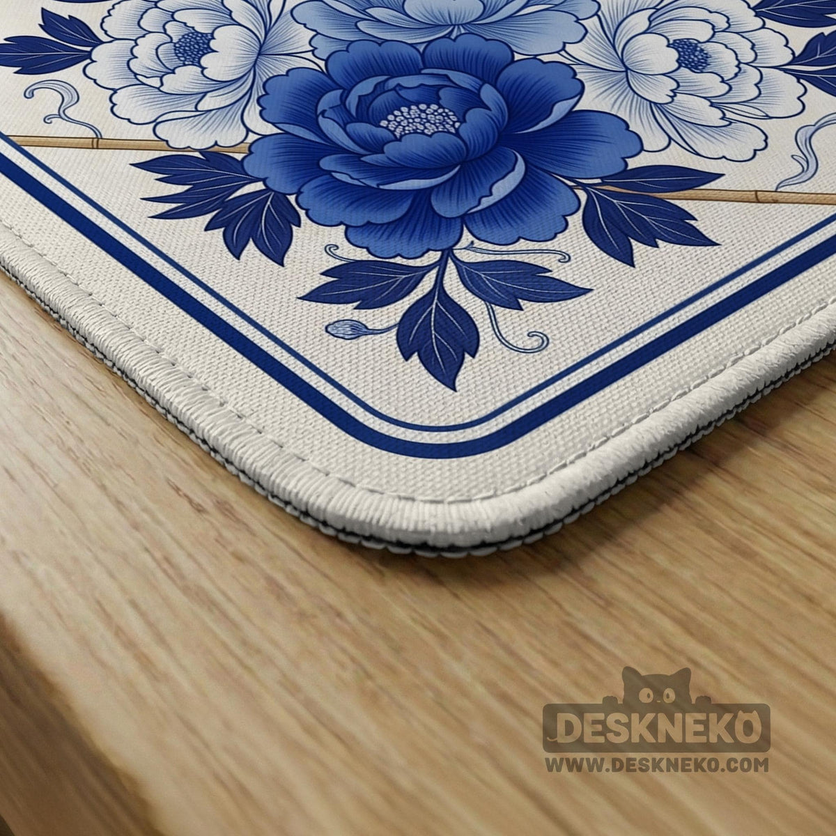Square blue and white mahjong mat with peonies, cranes, pagoda accents, and chinoiserie linework around a plain center.