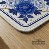 Square blue and white mahjong mat with peonies, cranes, pagoda accents, and chinoiserie linework around a plain center.