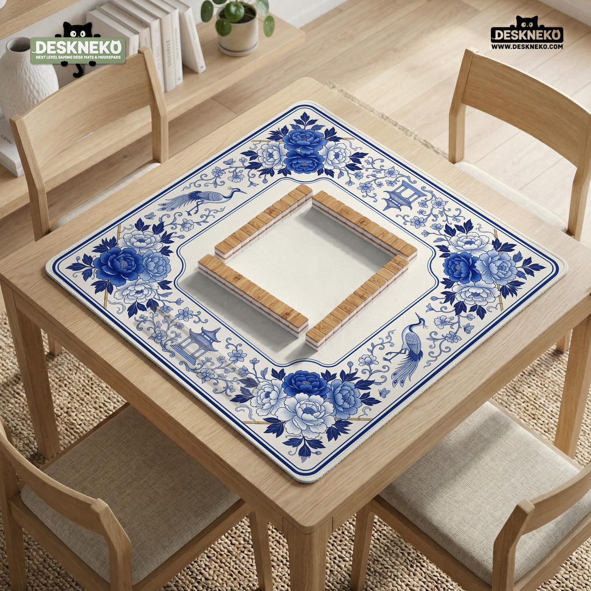 Square blue and white mahjong mat with peonies, cranes, pagoda accents, and chinoiserie linework around a plain center.
