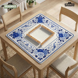 Square blue and white mahjong mat with peonies, cranes, pagoda accents, and chinoiserie linework around a plain center.