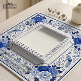 Square blue and white mahjong mat with peonies, cranes, pagoda accents, and chinoiserie linework around a plain center.