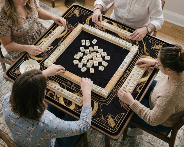 Black mahjong table mat with a gold dragon border, gold geometric corner details, and a clear center play area.