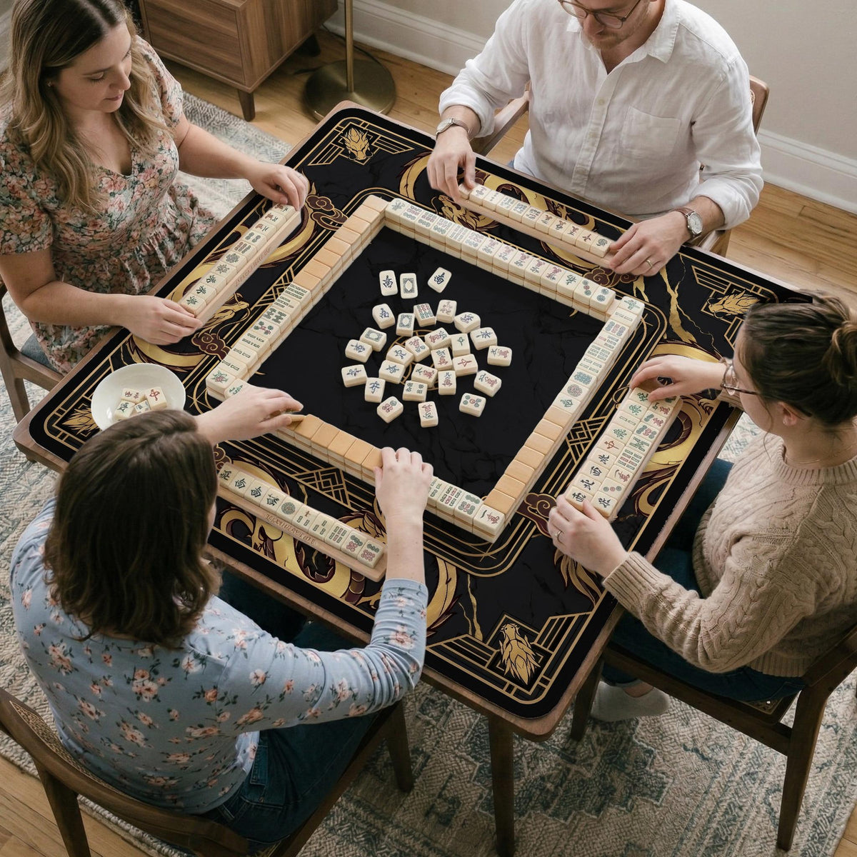 Black mahjong table mat with a gold dragon border, gold geometric corner details, and a clear center play area.