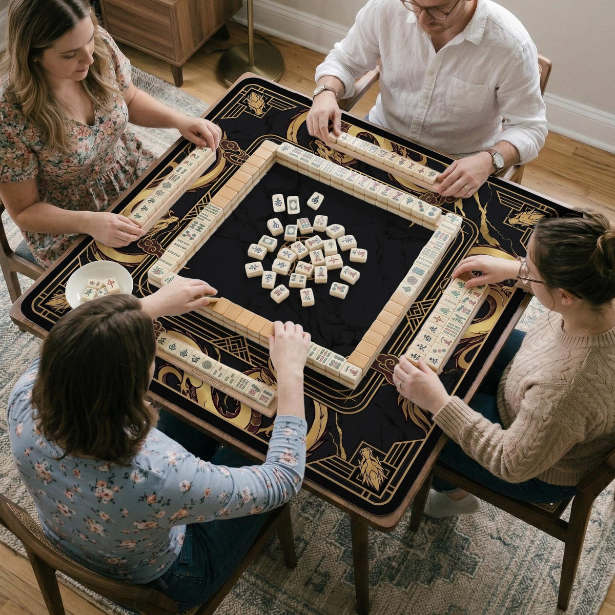 Square black mahjong mat with gold dragon artwork around the border and a light marble texture in the center.