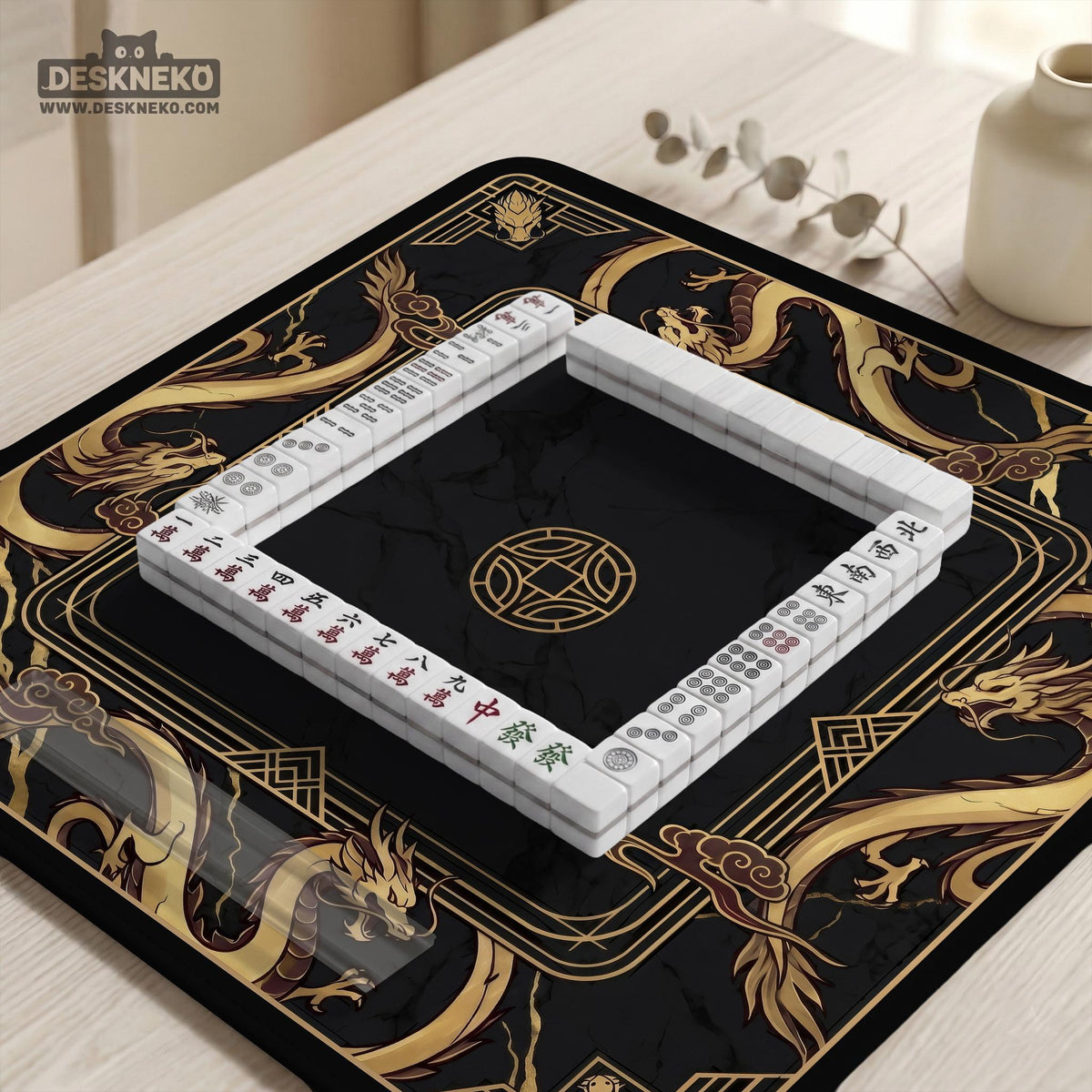 Square black mahjong mat with gold dragon artwork around the border and a light marble texture in the center.