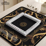 Square black mahjong mat with gold dragon artwork around the border and a light marble texture in the center.