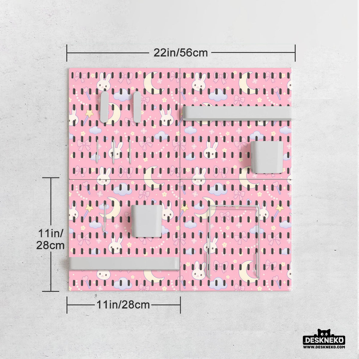 Pink pegboard panels with a kawaii bunny, cloud, moon, bow, and star pattern shown as a wall organizer set.