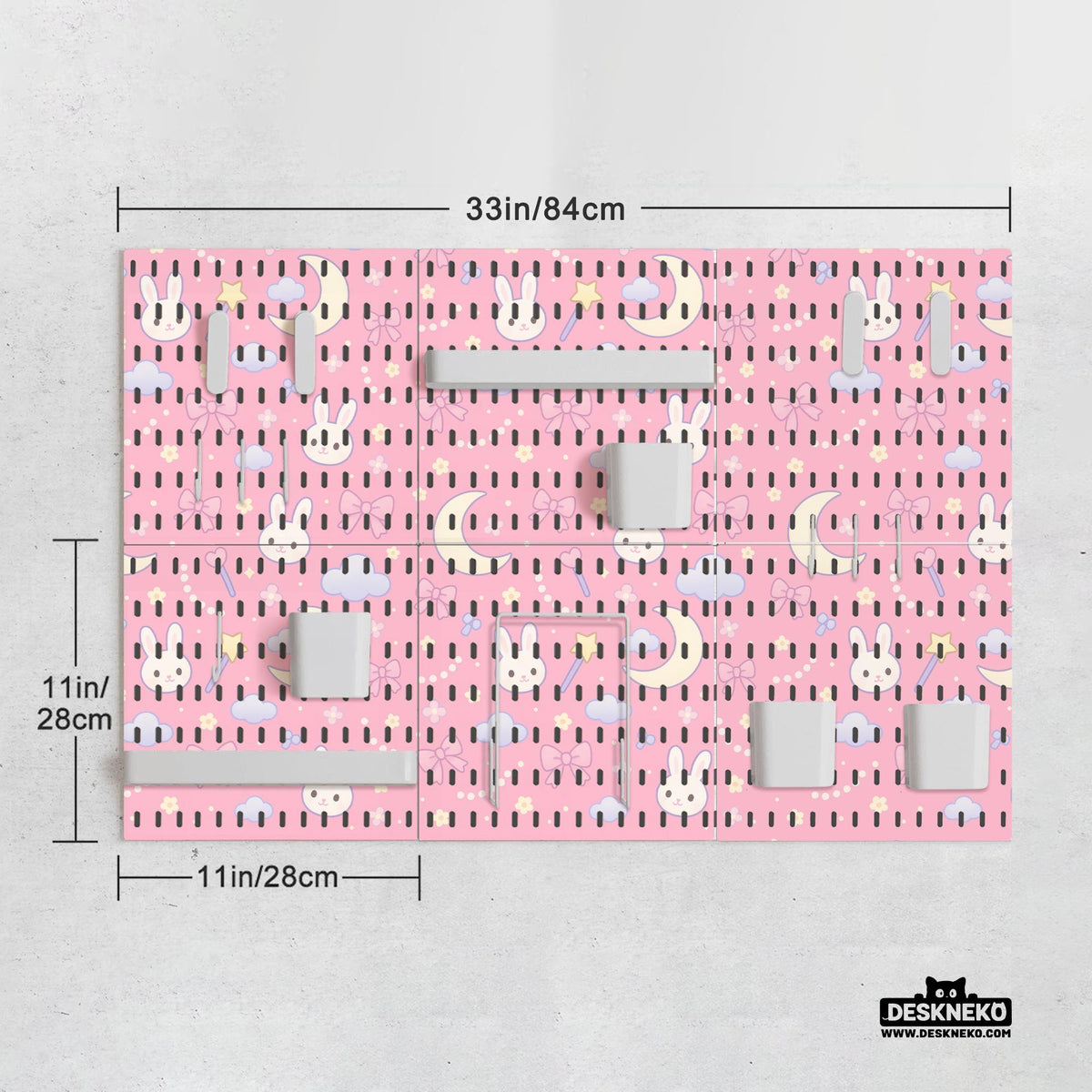 Pink pegboard panels with a kawaii bunny, cloud, moon, bow, and star pattern shown as a wall organizer set.