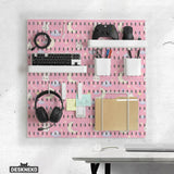 Pink pegboard panels with a kawaii bunny, cloud, moon, bow, and star pattern shown as a wall organizer set.