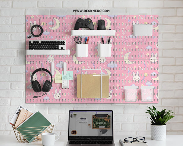 Pink pegboard panels with a kawaii bunny, cloud, moon, bow, and star pattern shown as a wall organizer set.