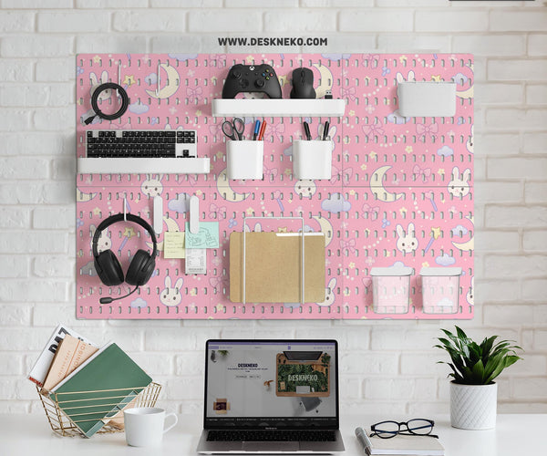Pink pegboard panels with a kawaii bunny, cloud, moon, bow, and star pattern shown as a wall organizer set.