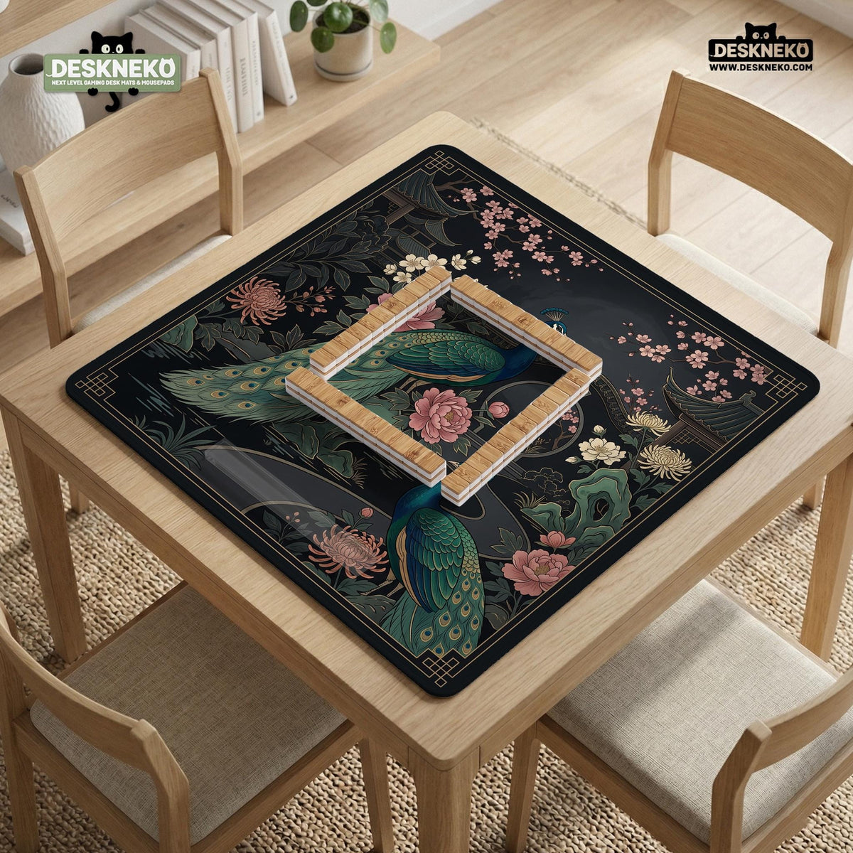 Square black mahjong mat with a gold peacock, blush flowers, and dark botanical artwork on a dark background.