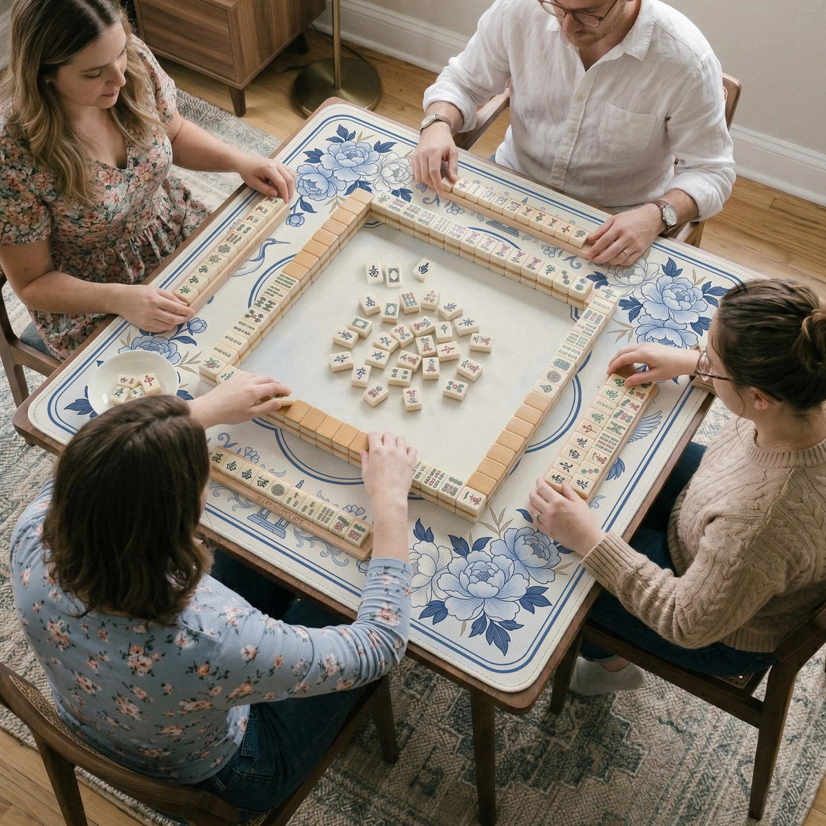 Square mahjong mat with a blue chinoiserie floral pattern on a light background.