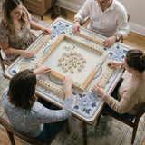 Square mahjong mat with a blue chinoiserie floral pattern on a light background.